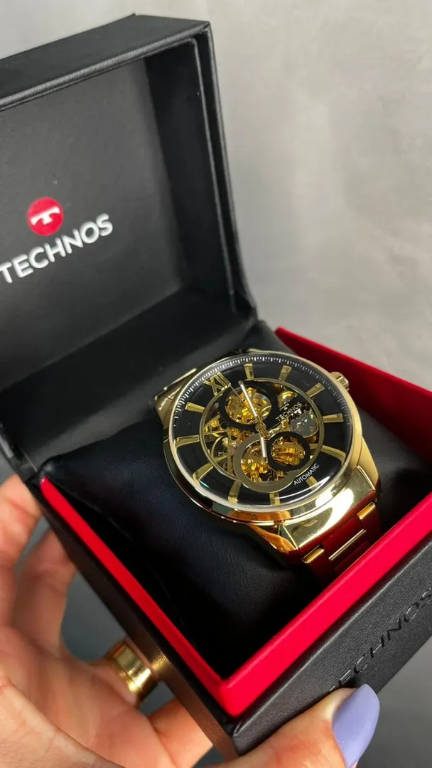 RELÓGIO TECHNOS DOURADO AUTOMÁTICO PULSEIRA EM AÇO INTERIOR PRETO VIDRO ABAULADO - COR DOURADO