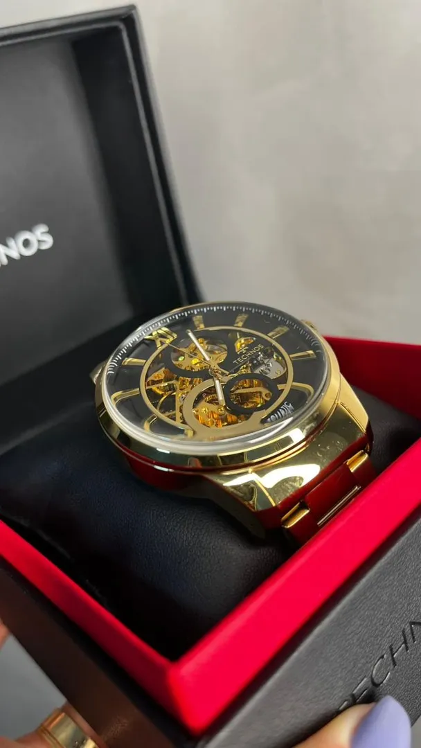 RELÓGIO TECHNOS DOURADO AUTOMÁTICO PULSEIRA EM AÇO INTERIOR PRETO VIDRO ABAULADO - COR DOURADO