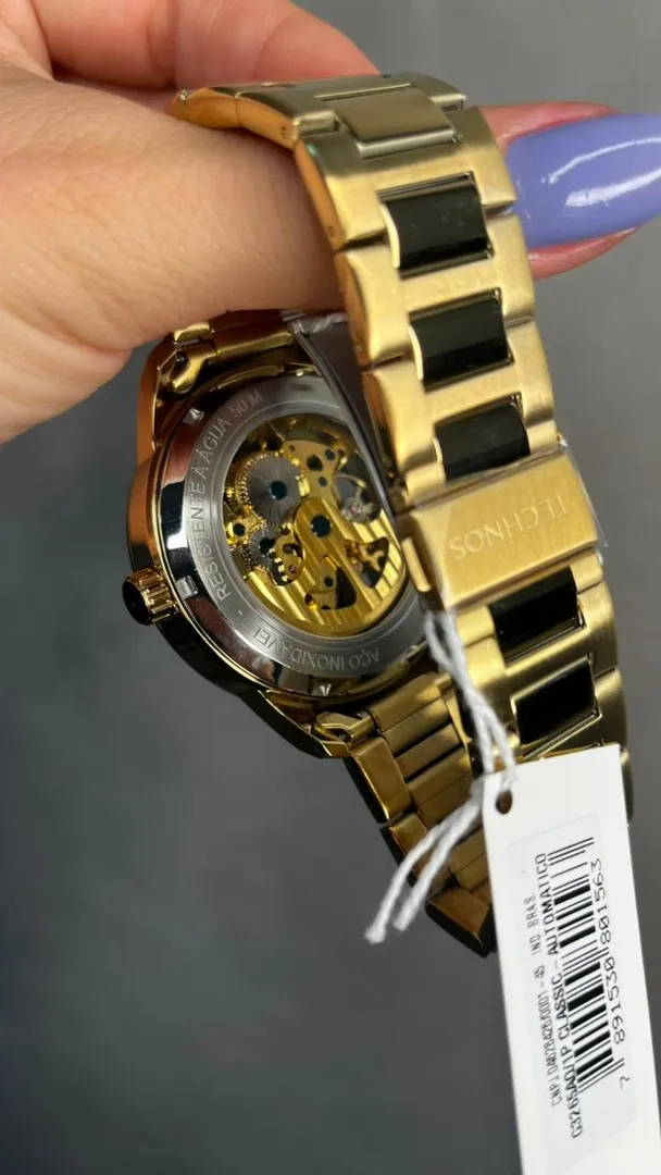 RELÓGIO TECHNOS DOURADO AUTOMÁTICO PULSEIRA EM AÇO INTERIOR PRETO VIDRO ABAULADO - COR DOURADO